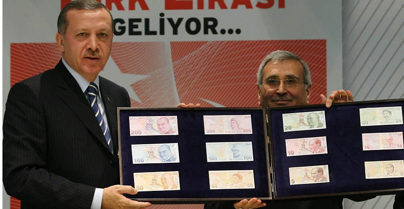 Turkish Prime Minister Erdogan and central bank governor Yilmaz with new Turkish banknotes during a news conference in Ankara